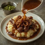 Gordon Ramsay onion gravy over beef sausages and mashed potatoes