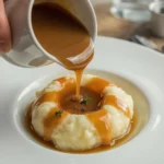 Turkey gravy without drippings poured over creamy mashed potatoes